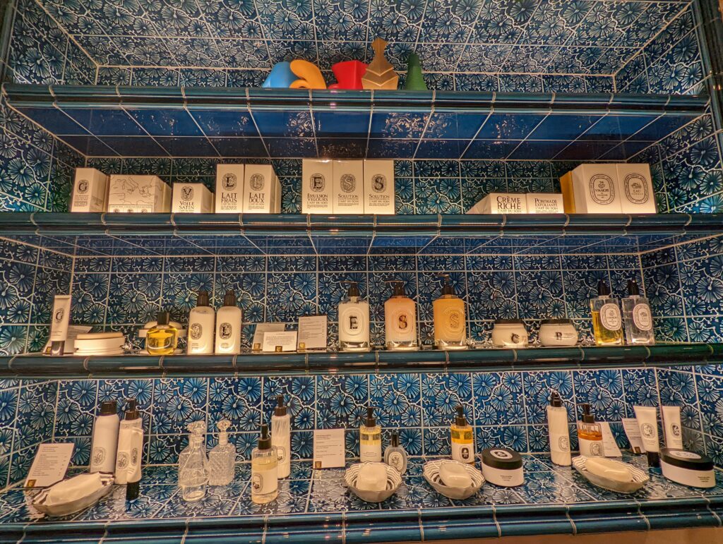 Unusual blue tiles behind the shelves of the niche perfumery Dyptique in Berlin Mitte