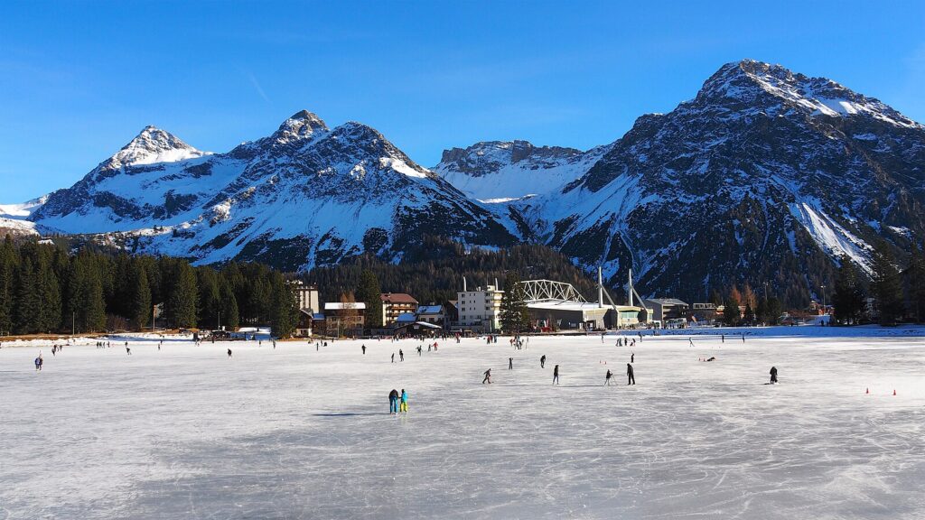 Natural Ice Skating on the frozen lake in Swiss Obersee near Arosa