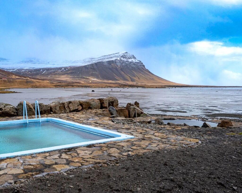 Krosslaug & Birkimelur Pool At sunset, it provides a serene ambiance by the seaside and Vatnsfjörður fjord.